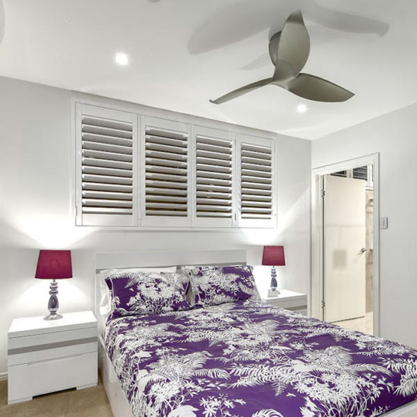 Bedroom with white plantation shutters in Geelong.