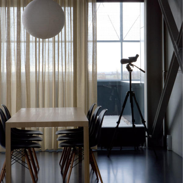 Modern dining area with beige sheer window furnishings in Geelong.