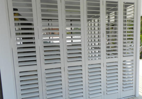 Doors with white aluminium plantation shutters on Torquay home.