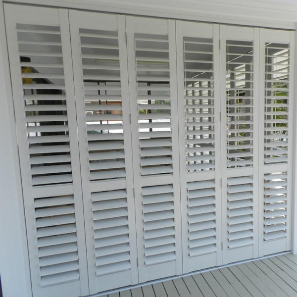 Doors with white aluminium plantation shutters on Torquay home.
