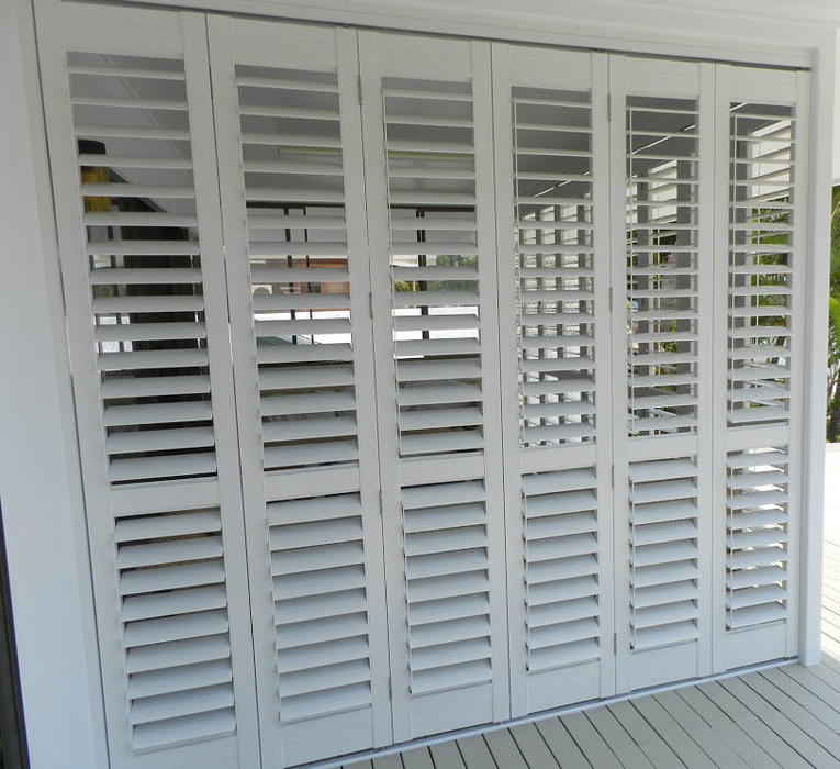 Doors with white aluminium plantation shutters on Torquay home.